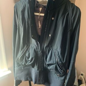 Gently loved Lululemon jacket with purple trimmed hood
